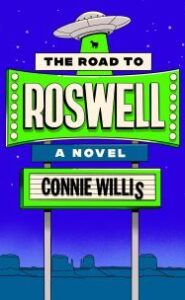 Image of a roadside sign with a flying saucer on top. Text says "The Road to Roswell A Novel Connie Willis"